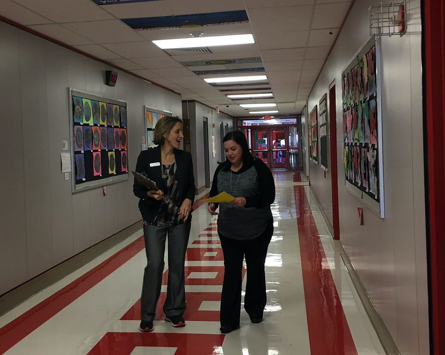 Cathy Doggett conducting a learning walk with a school leader